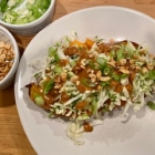 Stuffed Sweet Potato with Cabbage Slaw and Spicy Peanut Dressing